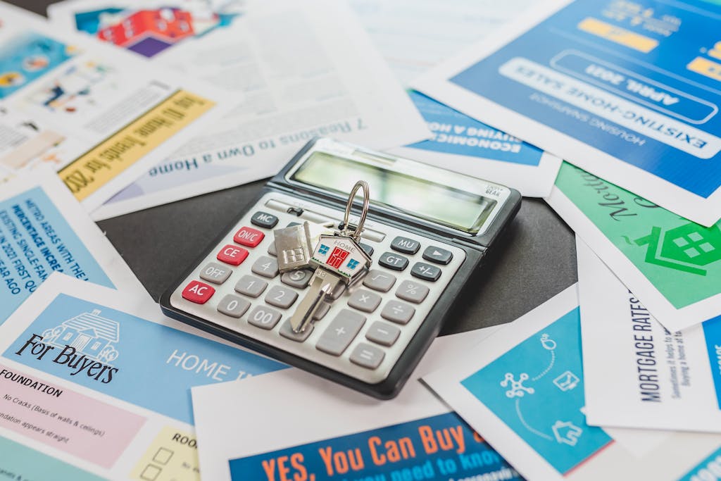 Gray and Black Desk Calculator - areas to invest in property